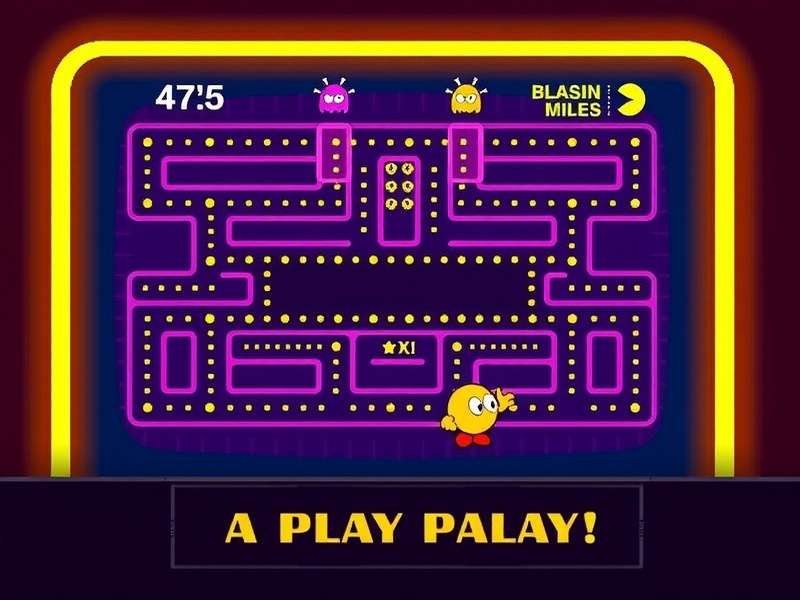 PAC MAN game displayed on a large television screen with colourful ghosts and maze, set up in an Indian living room